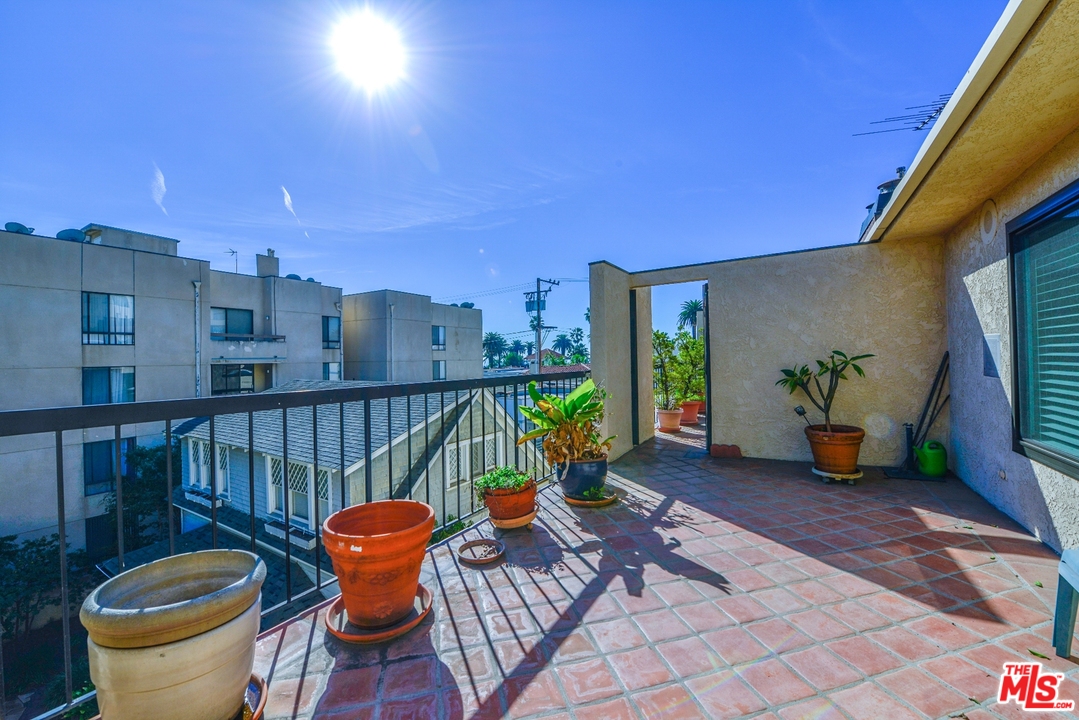 914 2nd Street, Unit B Santa Monica, CA 90403 - Photo 20 of 29 a view of a balcony with chair and potted plants