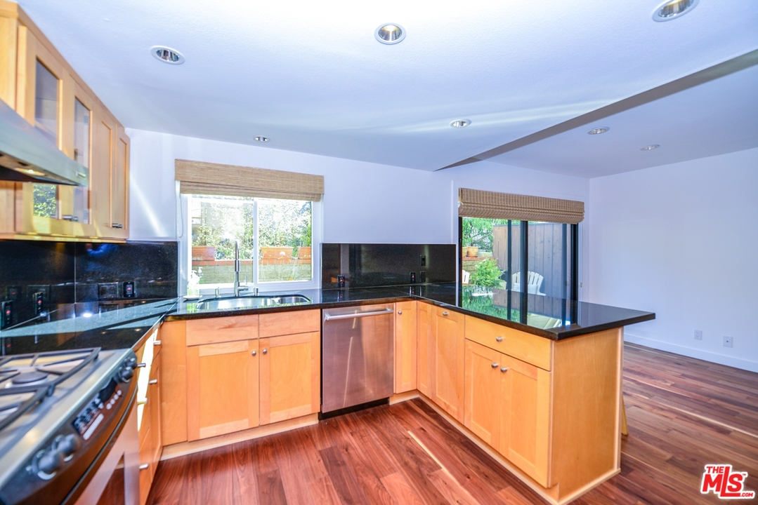 914 2nd Street, Unit B Santa Monica, CA 90403 - Photo 24 of 29 a kitchen with granite countertop a stove and a sink