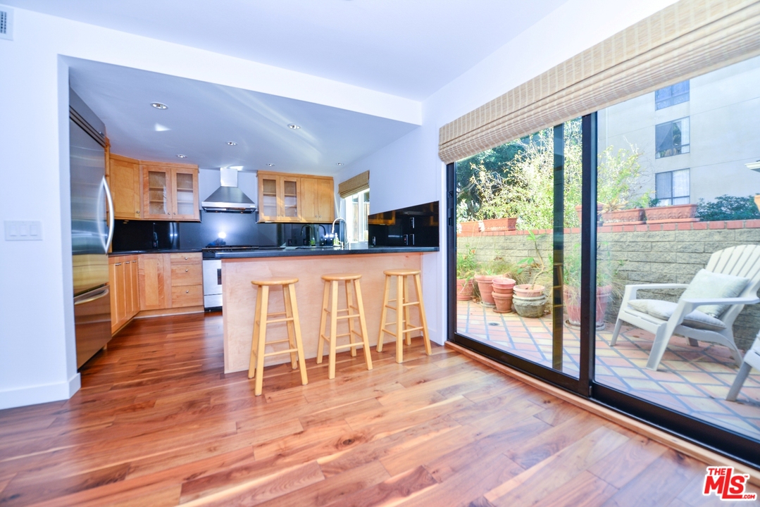 914 2nd Street, Unit B Santa Monica, CA 90403 - Photo 5 of 29 a view of kitchen with furniture and wooden floor