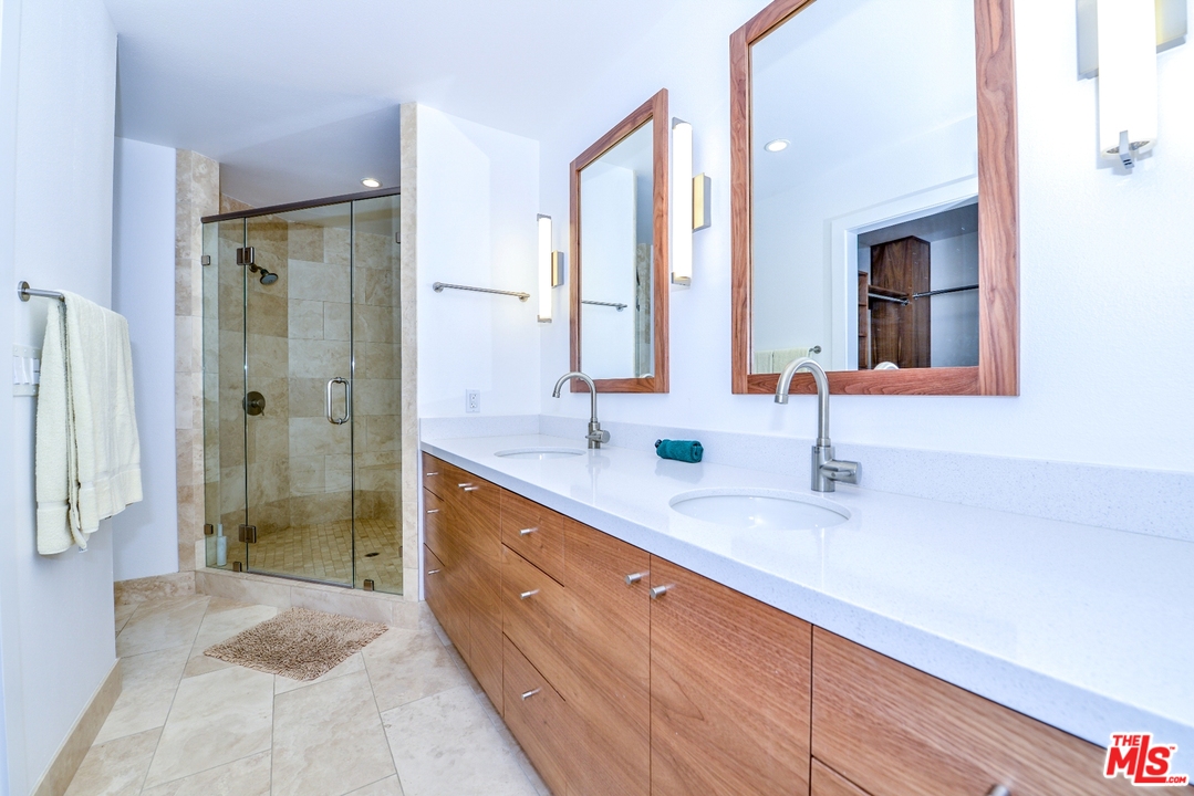 914 2nd Street, Unit B Santa Monica, CA 90403 - Photo 10 of 29 a spacious bathroom with a shower sink and mirror