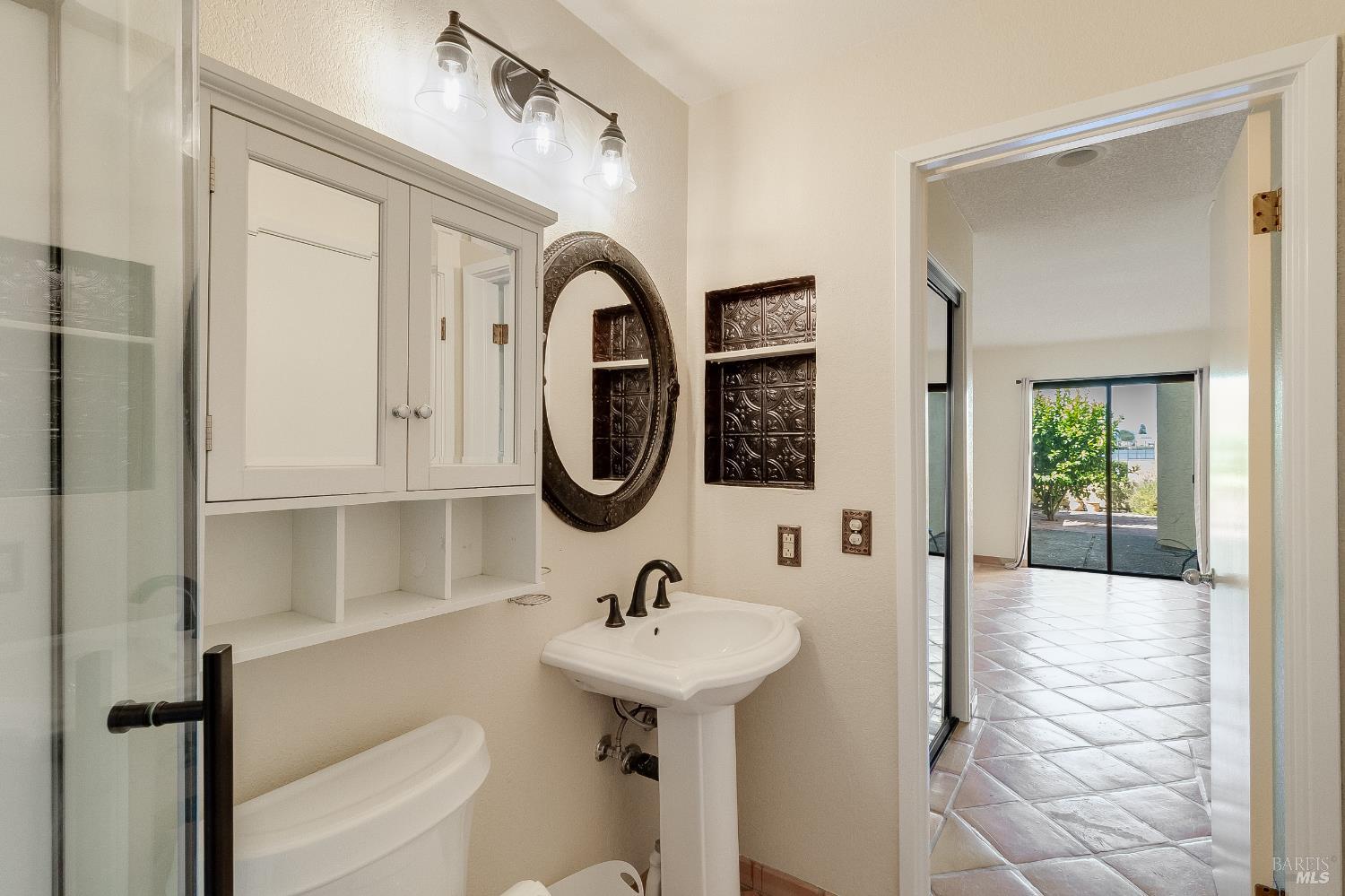 171 Nantucket Lane Vallejo, CA 94590 - Photo 21 of 56 a bathroom with a sink a mirror and a shower