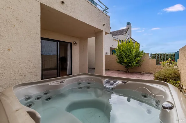 a bathroom with a tub and sink