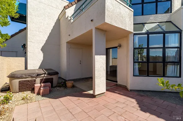 a view of a lounge chair in the house front of house