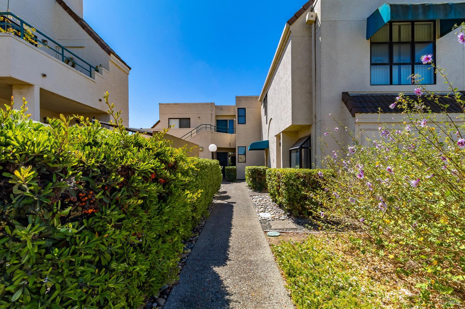 171 Nantucket Lane Vallejo, CA 94590 - Photo 36 of 56 a front view of a house with a yard and fountain