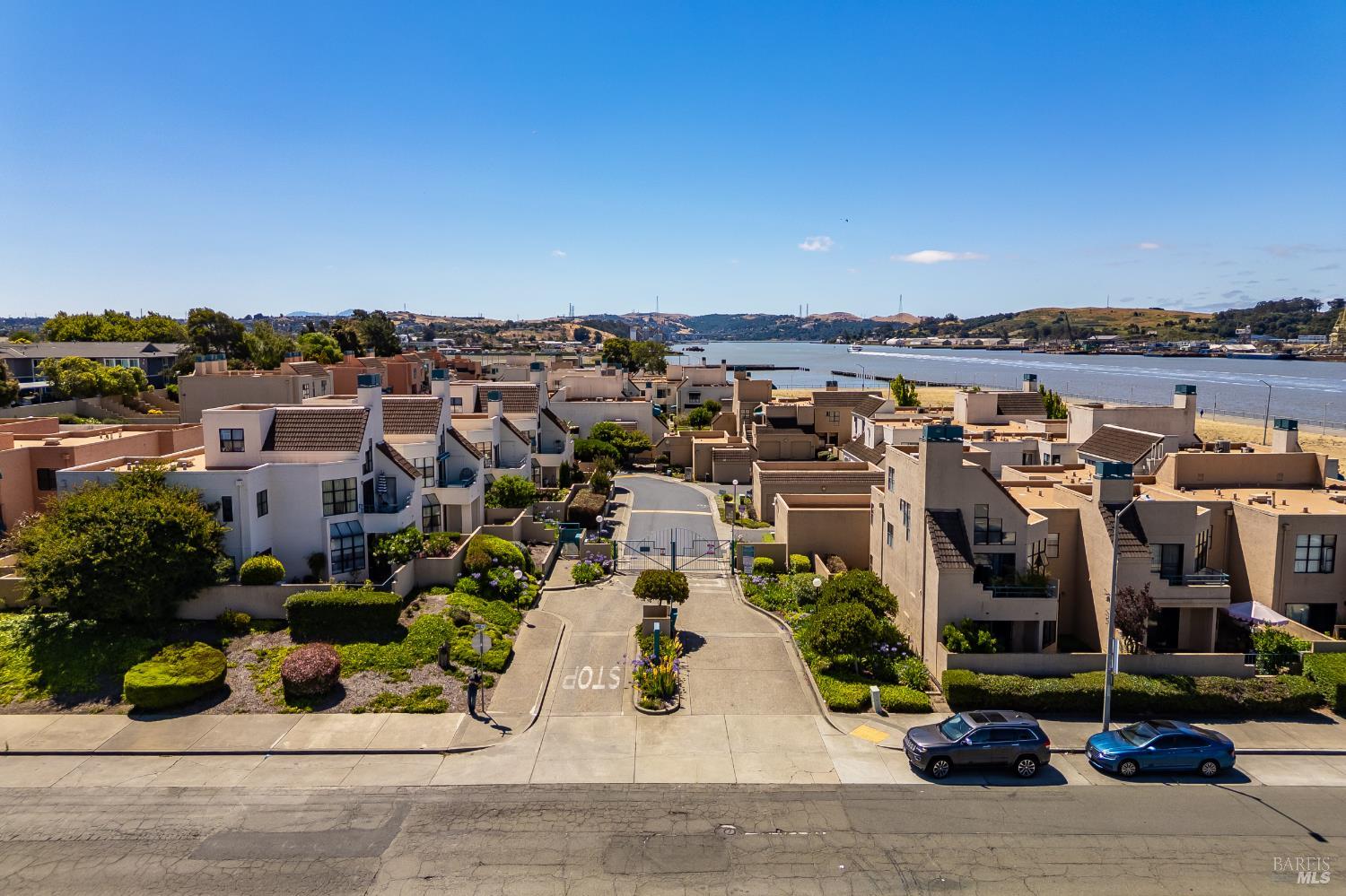 171 Nantucket Lane Vallejo, CA 94590 - Photo 44 of 56 an aerial view of a building with a garden and parking space