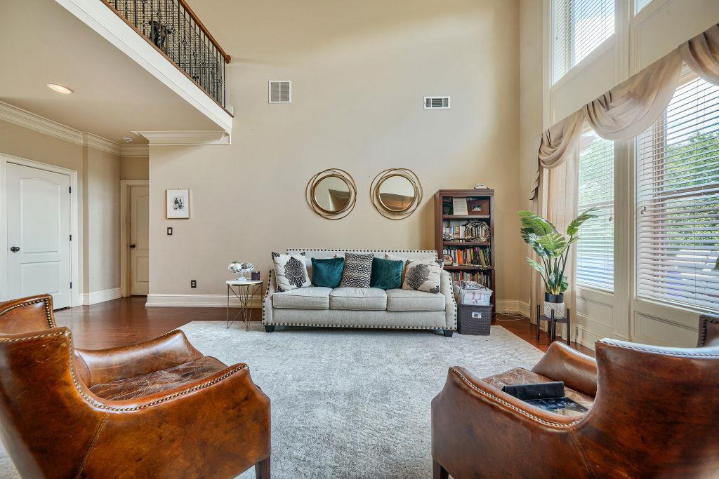345 Masters Club Boulevard Hampton, GA 30228 - Photo 10 of 30 a living room with furniture and a large window