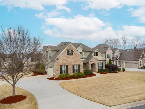 a front view of a house with a yard