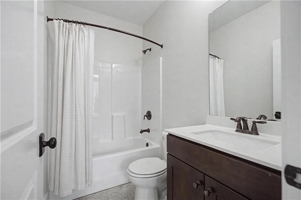 3769 Cheyenne Lane Jefferson, GA 30549 - Photo 12 of 49 a bathroom with a sink a toilet a tub and shower