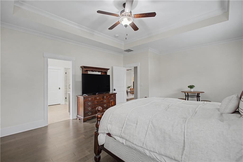 3769 Cheyenne Lane Jefferson, GA 30549 - Photo 24 of 49 a bedroom with a bed and a flat screen tv
