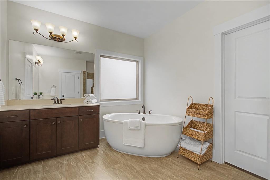 3769 Cheyenne Lane Jefferson, GA 30549 - Photo 25 of 49 a spacious bathroom with a bathtub and a sink