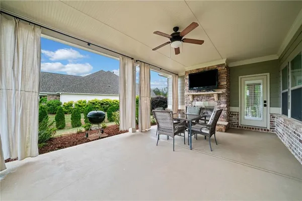 a view of a house with a yard and mountain view