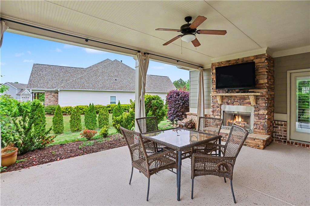 3769 Cheyenne Lane Jefferson, GA 30549 - Photo 36 of 49 a view of a patio with table and chairs with potted plants