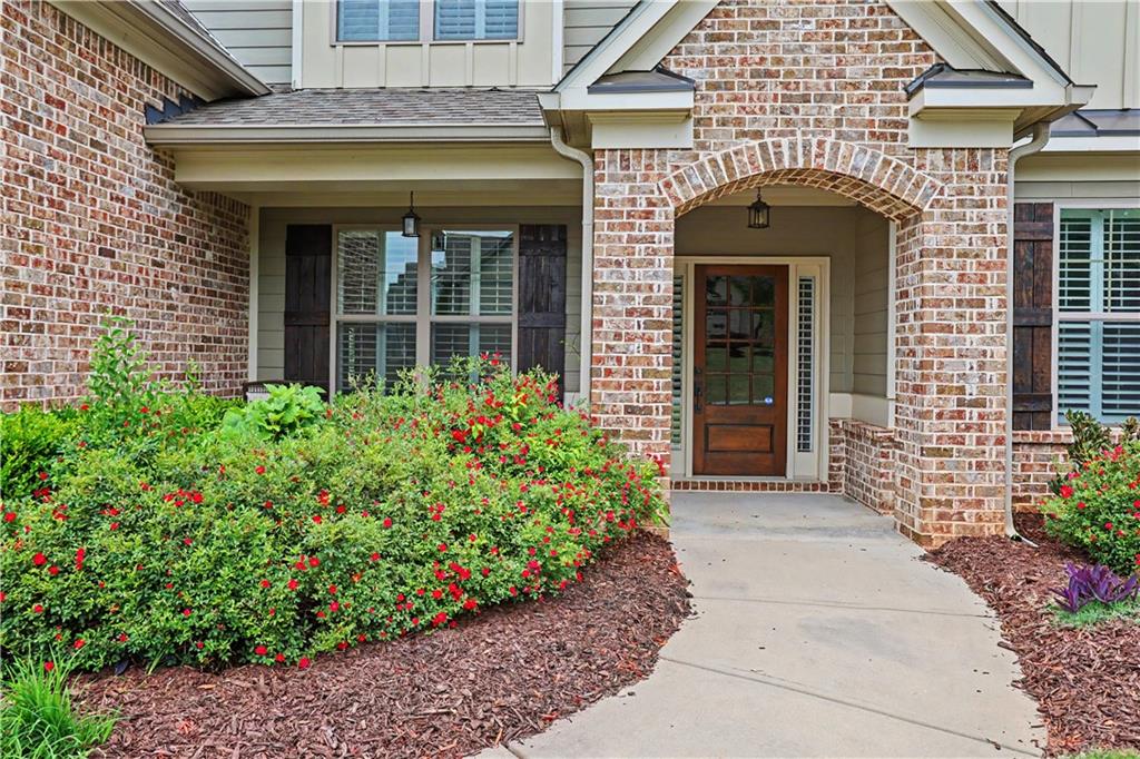 3769 Cheyenne Lane Jefferson, GA 30549 - Photo 4 of 49 a front view of a house with a garden