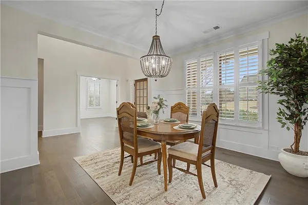 a view of a dining room with furniture and window