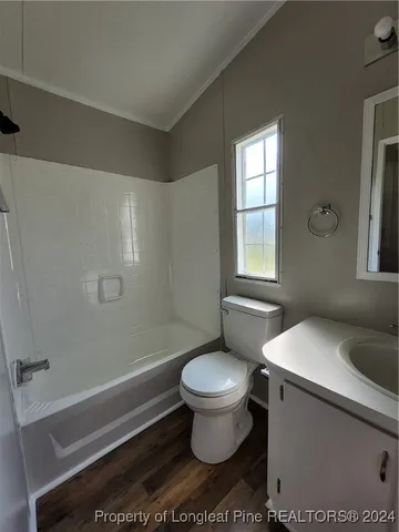 a bathroom with a shower and a toilet
