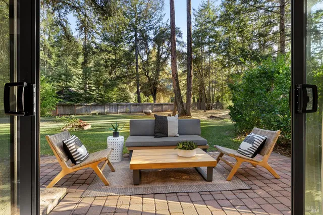 a view of a livingroom with furniture and a window