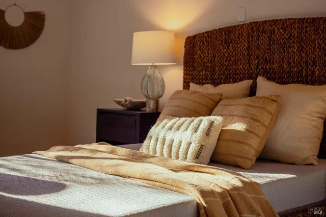 a bedroom with a bed and a couch