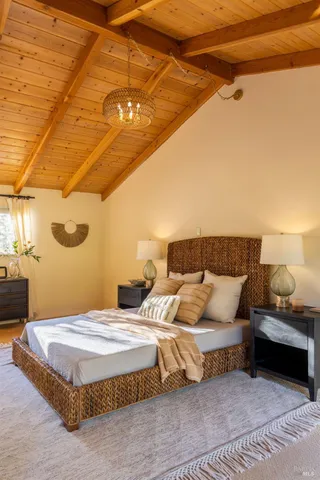 a bedroom with bed and window