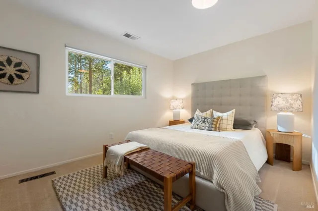 a bedroom with a bed and a fireplace