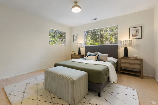 a spacious bathroom with a shower and a sink