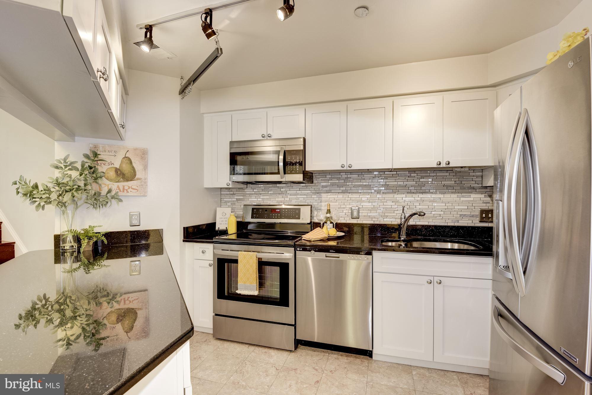 1301 North Courthouse Road, Unit 1812 Arlington, VA 22201 - Photo 2 of 30 Kitchen with refaced cabinets, granite, SS appls.