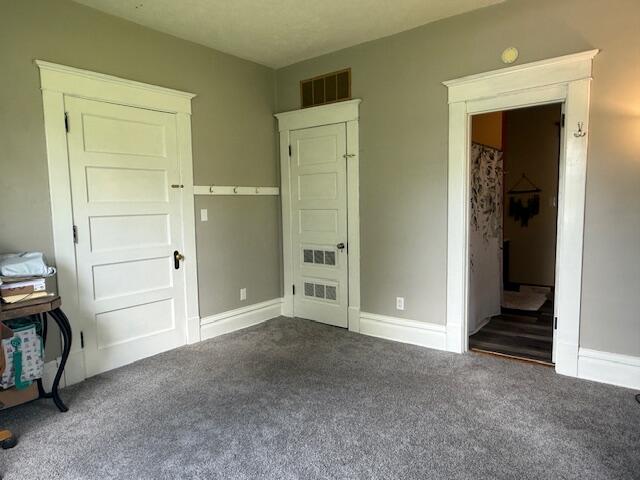 806 North 4th Street Kentland, IN 47951 - Photo 17 of 29 an empty room with closet and mirror