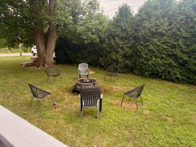 806 North 4th Street Kentland, IN 47951 - Photo 6 of 29 a view of swimming pool with a bench and trees around