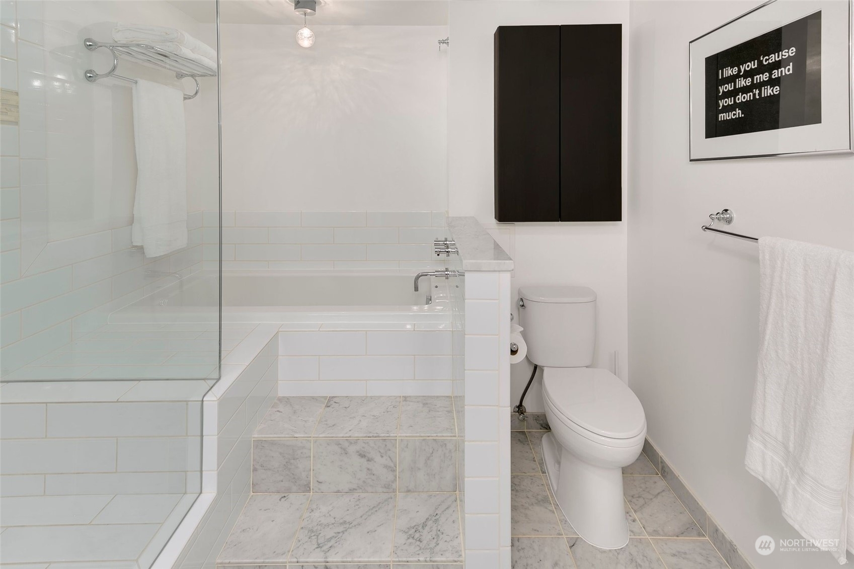 1301 Spring Street, Unit 6A Seattle, WA 98104 - Photo 14 of 33 a bathroom with a toilet and a shower