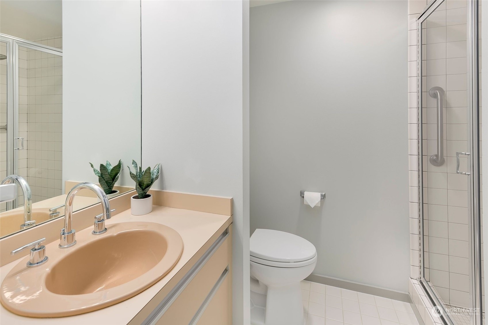 1301 Spring Street, Unit 6A Seattle, WA 98104 - Photo 17 of 33 a bathroom with a sink a toilet and shower