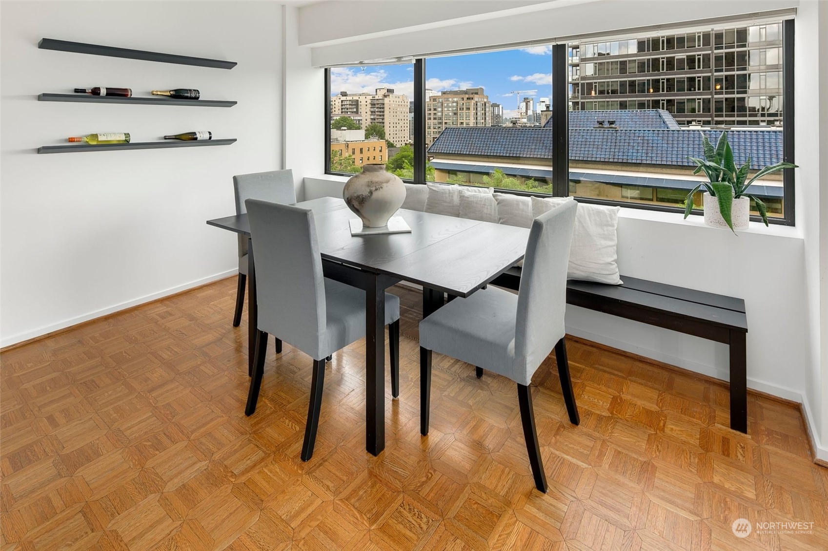 1301 Spring Street, Unit 6A Seattle, WA 98104 - Photo 4 of 33 a dining room with furniture and a floor to ceiling window