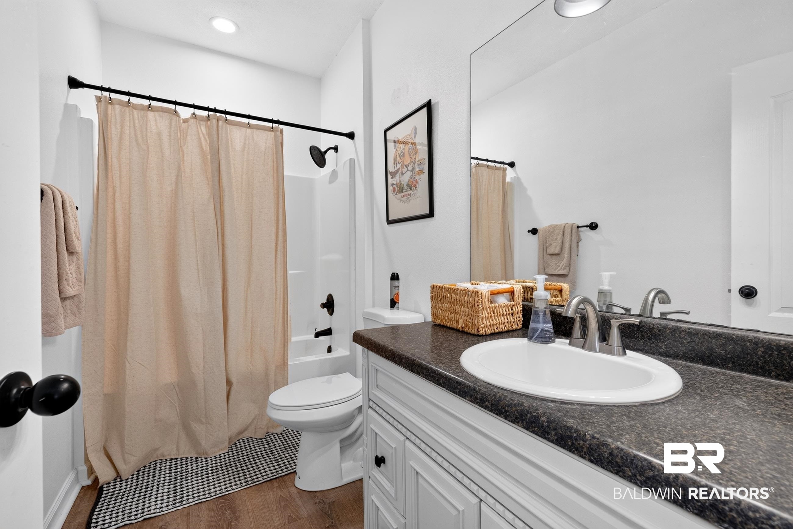 17419 Lewis Smith Drive Foley, AL 36535 - Photo 31 of 38 Full bathroom featuring a white vanity with paneled cabinetry, dark speckled countertop, and an oval undermount sink with brushed nickel faucet