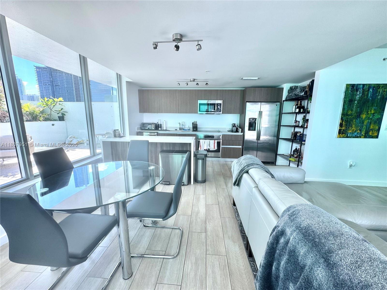 1600 Southwest 1st Avenue, Unit 910 Miami, FL 33129 - Photo 3 of 11 a view of a dining room with furniture