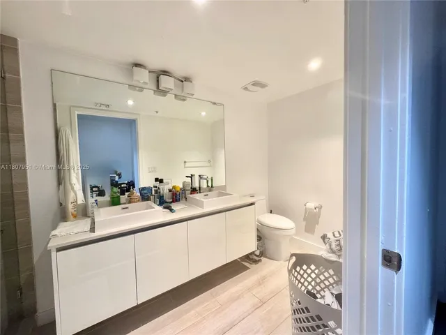 a view of a bathroom from a hallway