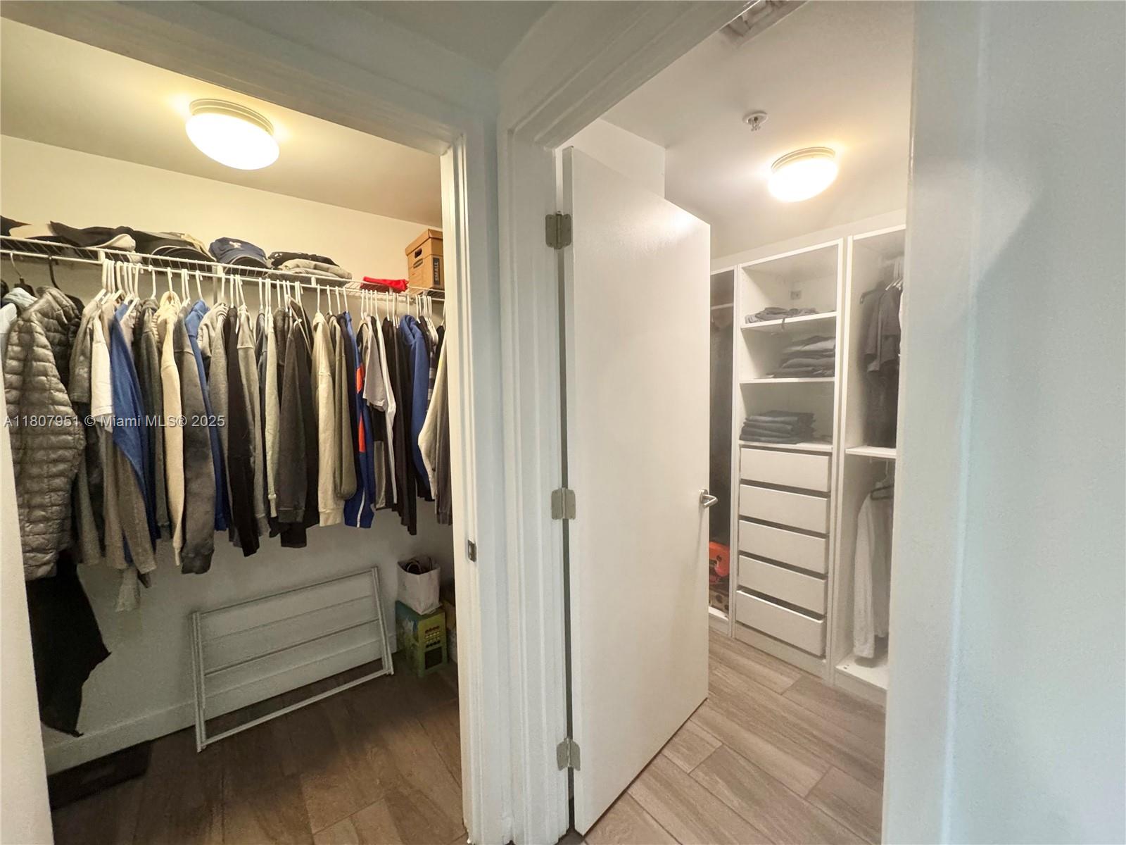1600 Southwest 1st Avenue, Unit 910 Miami, FL 33129 - Photo 10 of 11 a view of walk in closet with clothes and shoes