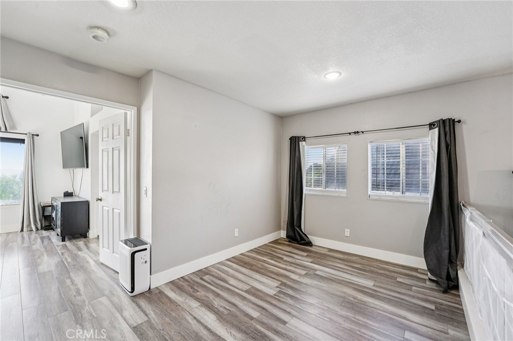 17586 Mountain Court Riverside, CA 92503 - Photo 15 of 39 a view of a livingroom with wooden floor and furniture