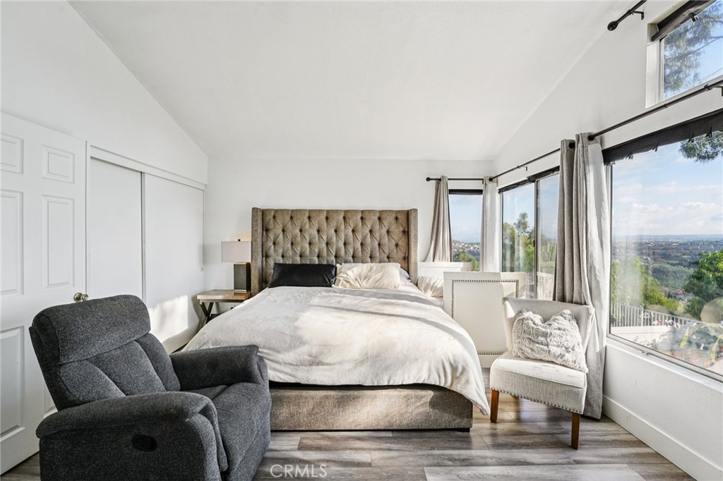 17586 Mountain Court Riverside, CA 92503 - Photo 16 of 39 a bedroom with a bed and a large window