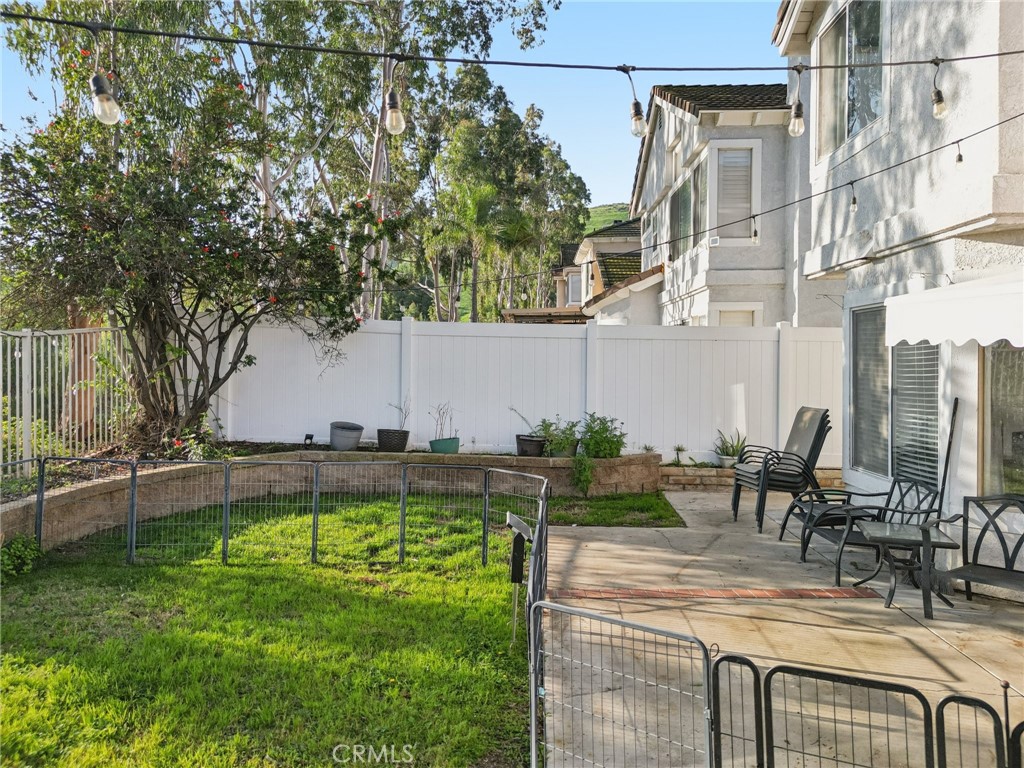 17586 Mountain Court Riverside, CA 92503 - Photo 28 of 39 a view of backyard with swimming pool and seating space
