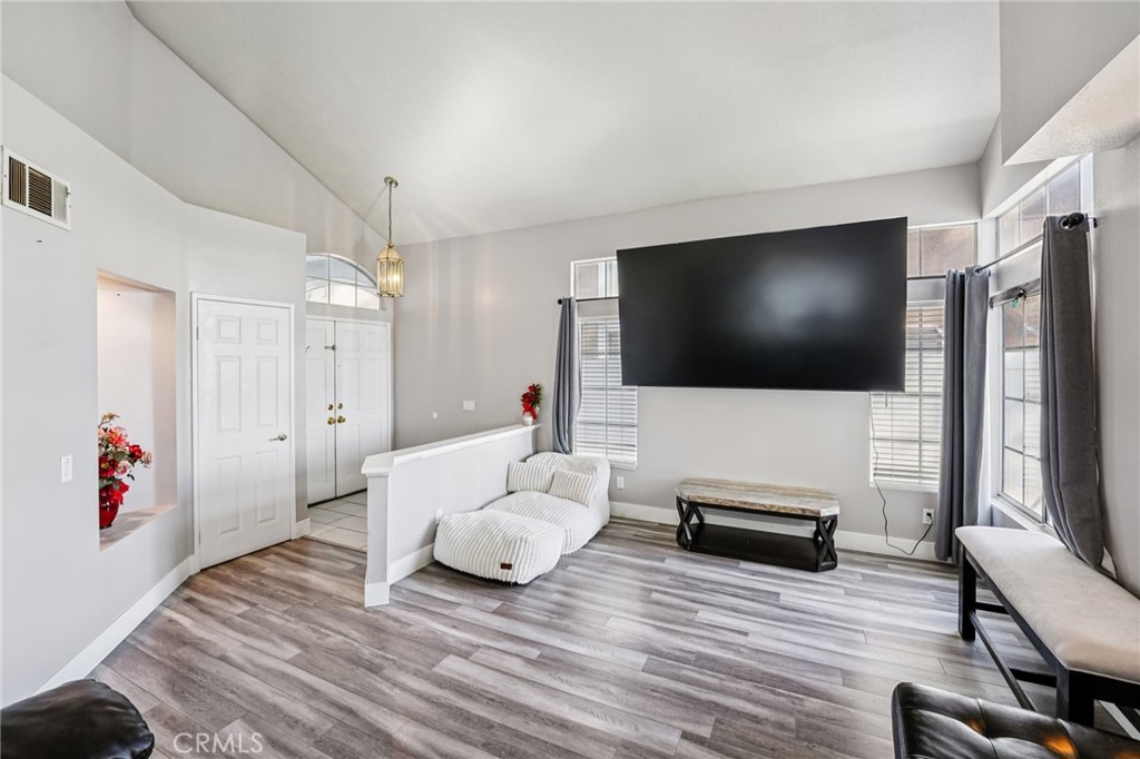 17586 Mountain Court Riverside, CA 92503 - Photo 4 of 39 a living room with furniture and a flat screen tv