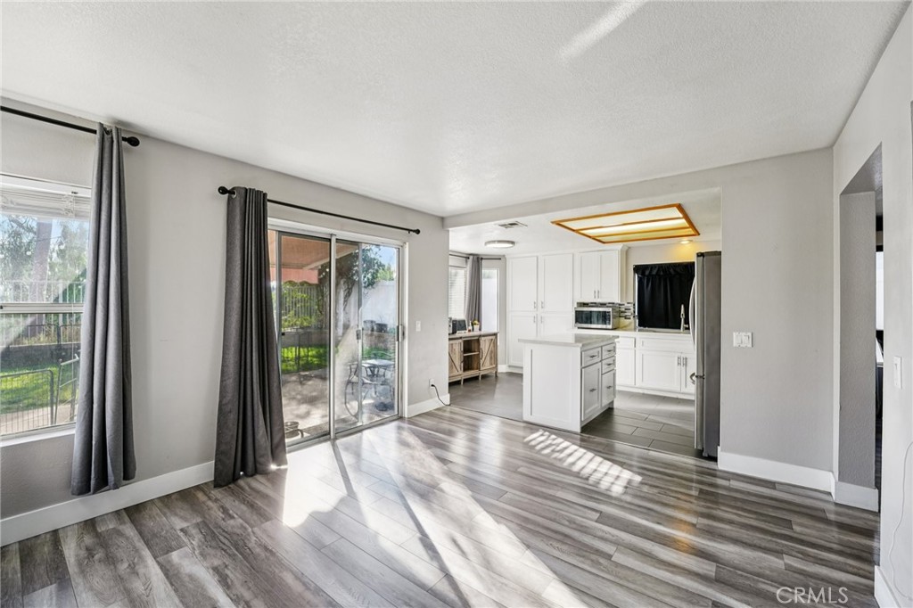 17586 Mountain Court Riverside, CA 92503 - Photo 8 of 39 a view of a living room with furniture and large windows