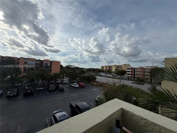 a view of a city from a cars park