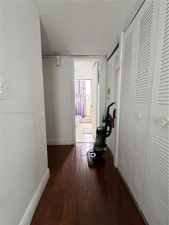 a view of a livingroom with hardwood floor and a window