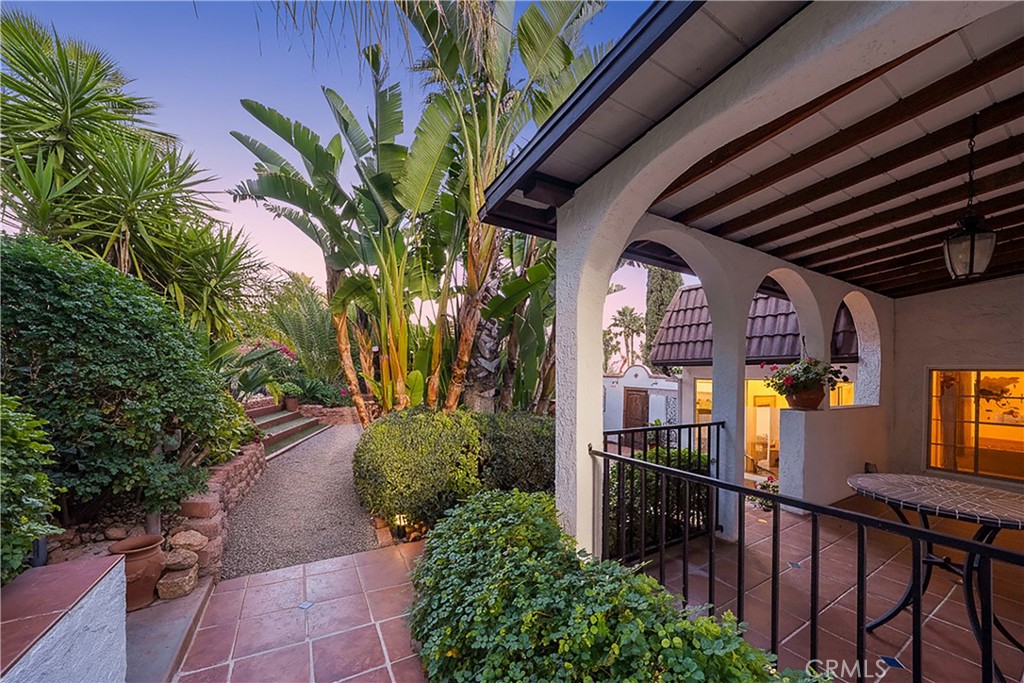 23734 Vista Ramona Road Ramona, CA 92065 - Photo 17 of 62 a view of a porch with potted plants and stairs