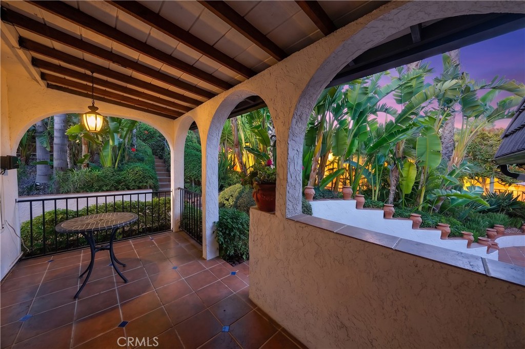 23734 Vista Ramona Road Ramona, CA 92065 - Photo 20 of 62 a view of a porch with chairs and potted plants
