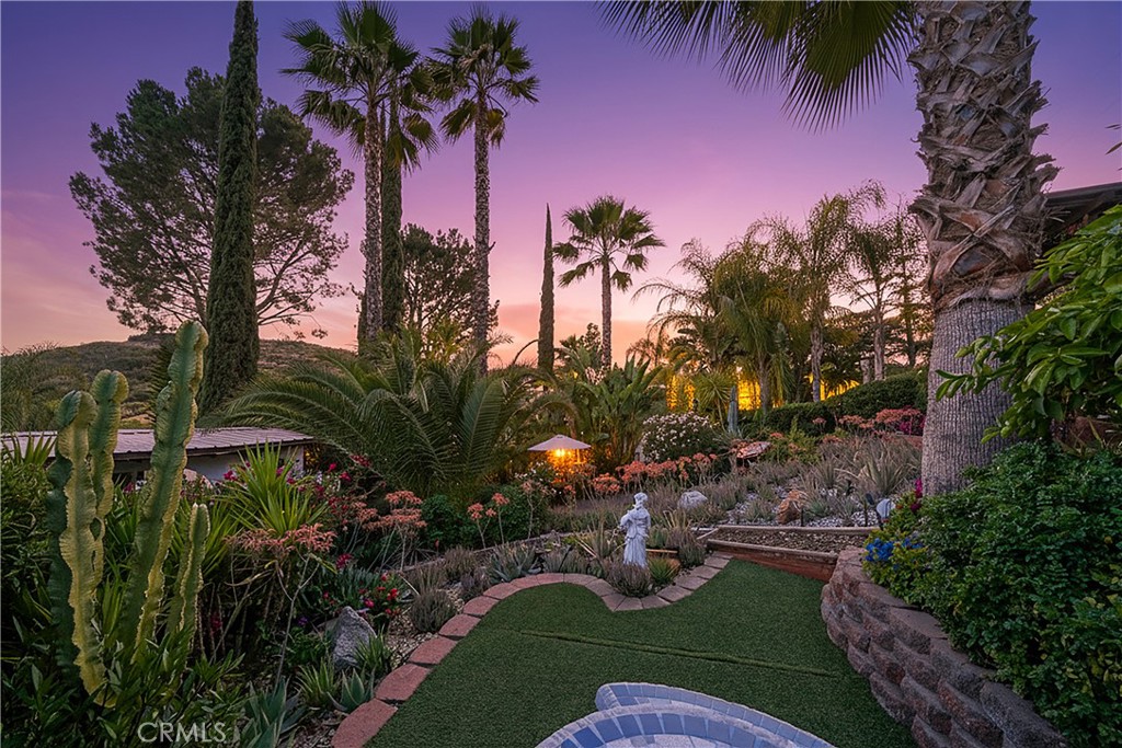 23734 Vista Ramona Road Ramona, CA 92065 - Photo 23 of 62 a backyard of a house with a garden and outdoor seating