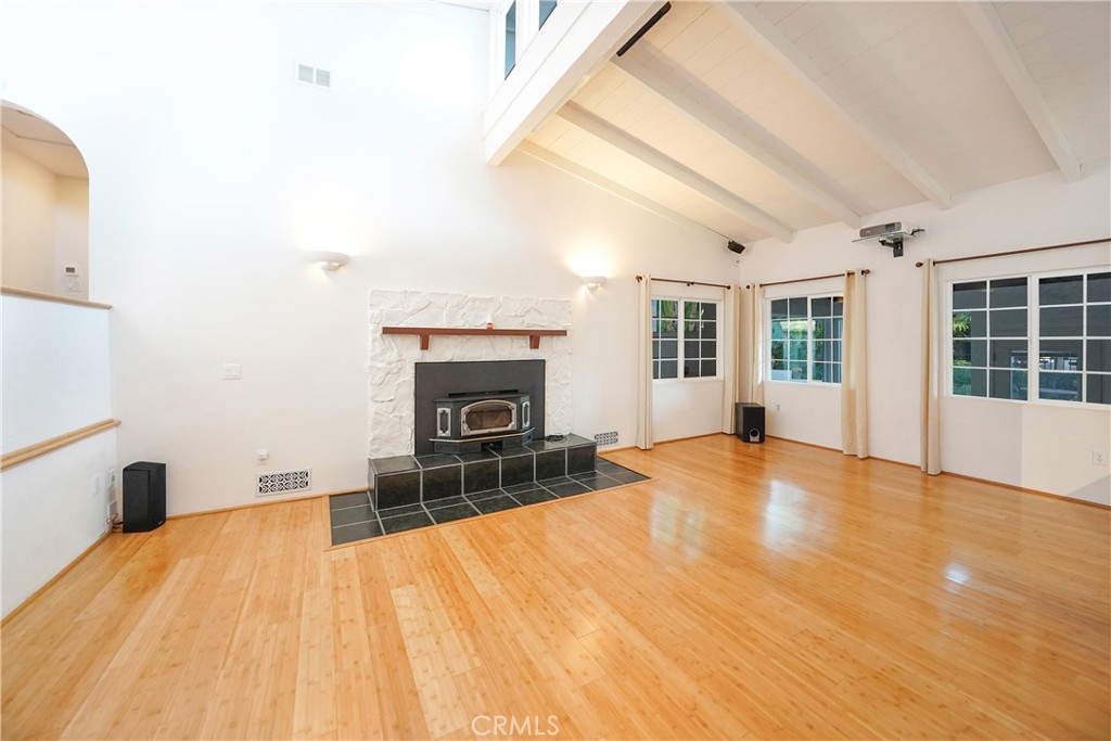 23734 Vista Ramona Road Ramona, CA 92065 - Photo 27 of 62 a view of empty room with wooden floor and fireplace