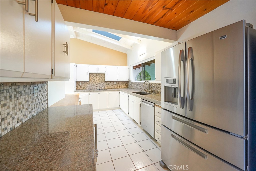 23734 Vista Ramona Road Ramona, CA 92065 - Photo 34 of 62 a large kitchen with cabinets and stainless steel appliances