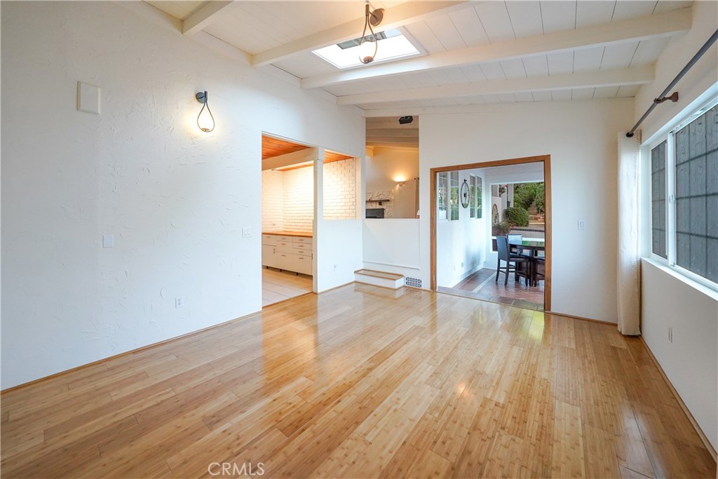 23734 Vista Ramona Road Ramona, CA 92065 - Photo 36 of 62 a big room with wooden floor and windows