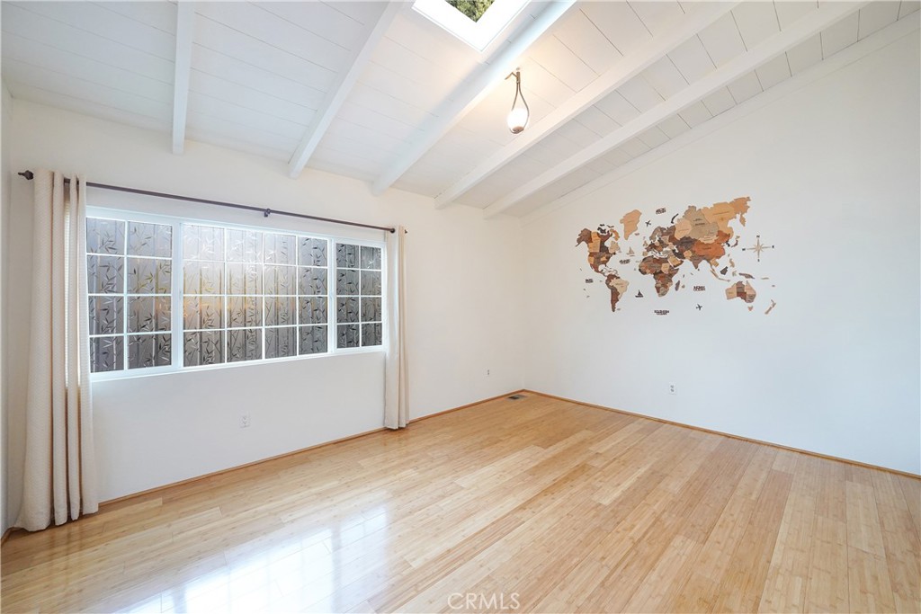 23734 Vista Ramona Road Ramona, CA 92065 - Photo 37 of 62 an empty room with wooden floor and windows