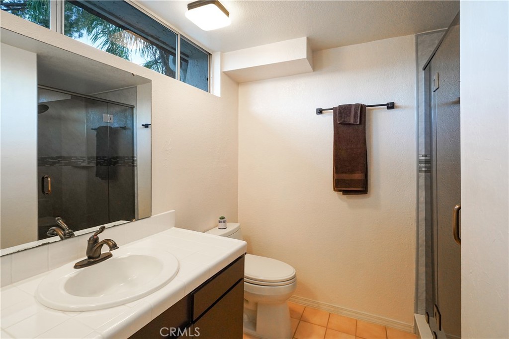 23734 Vista Ramona Road Ramona, CA 92065 - Photo 42 of 62 a bathroom with a sink and a mirror