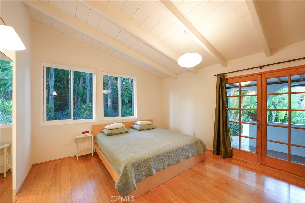 23734 Vista Ramona Road Ramona, CA 92065 - Photo 43 of 62 a bedroom with a large bed and a large window